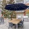 outdoor grill area with tables and chairs